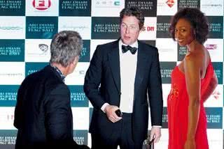 Eddie Jordan, ex-dono de equipe de F-1, ator Hugh Grant e a cantora Beverley Knight na festa Chequered Flag Ball, em Abu Dhabi. - ADRIANO CAPELO, ANDRE VICENTE, AUGUSTO MESTIERI, BRUNO SANTOS, CRIS FUSCO, REUTERS, WAYNE CAMARGO