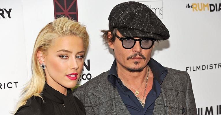 Amber Heard e Johnny Depp na première de 'The Rum Diary' em Nova York - Getty Images