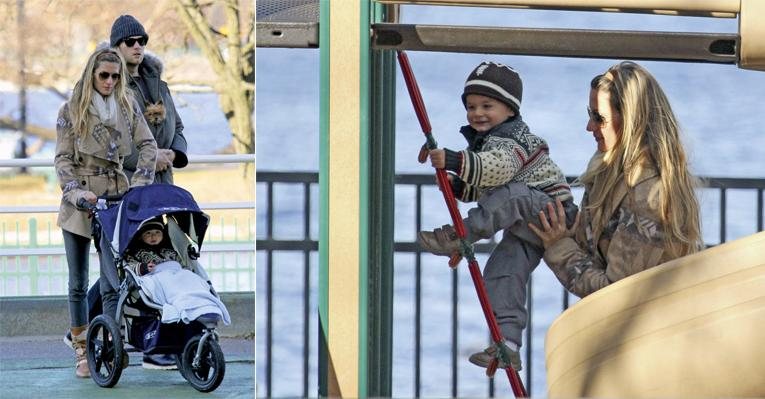 O termômetro marca temperatura abaixo de zero, mas a top e o ídolo do futebol americano encaram o frio para entreter o filho em um parque da cidade. - Bauer Griffin