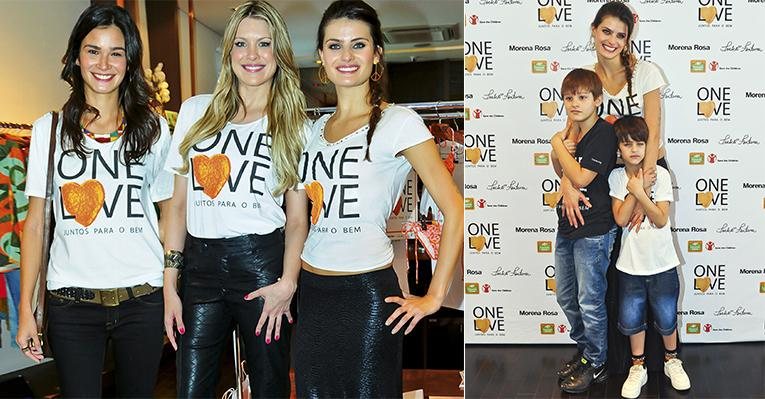 A top recebe o carinho dos filhos, Zion e Lucas, no lançamento da campanha One Love, em SP. As apresentadoras Caroline Ribeiro e Renata Fan com Isa. - João Passos/ Brasil Fotopress