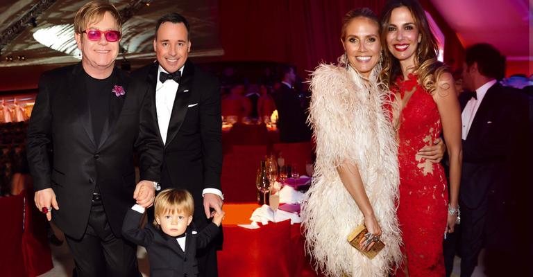 Com o herdeiro, o fofo Zachary, Elton e David recebem vips em evento pós Oscar. As musas Heidi Klum e Lu trocam elogios. - Getty Images