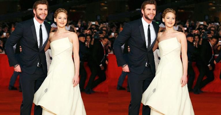 Jennifer Lawrence aparece elegante no red carpet ao lado do companheiro de filmagens Liam Hemsworth - Tony Gentile/ Reuters