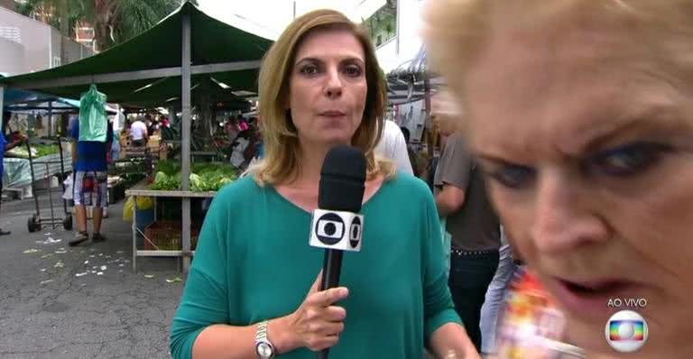 Senhora invade link da TV Globo ao vivo durante transmissão em feira de rua - TV Globo/Reprodução