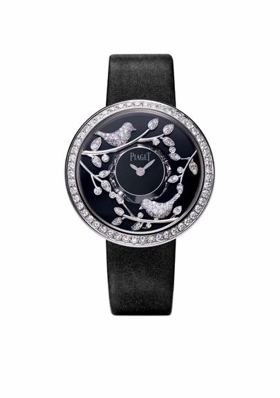 Mundo Animal: Com caixa de ouro branco e brilhantes, mostrador com folhas e pássaros rotativos de brilhantes e pulseira de cetim PIAGET [piaget.com] 