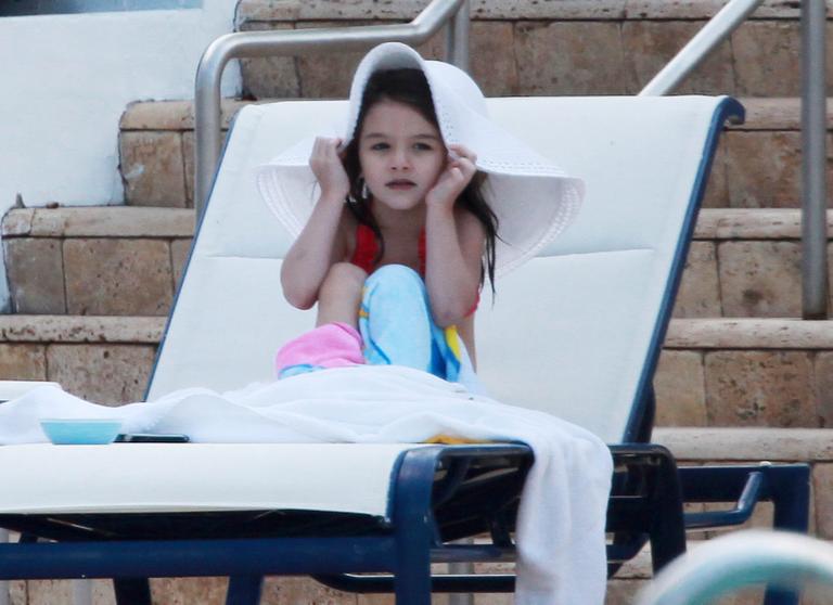 Suri Cruise e suas caretas para os paparazzi