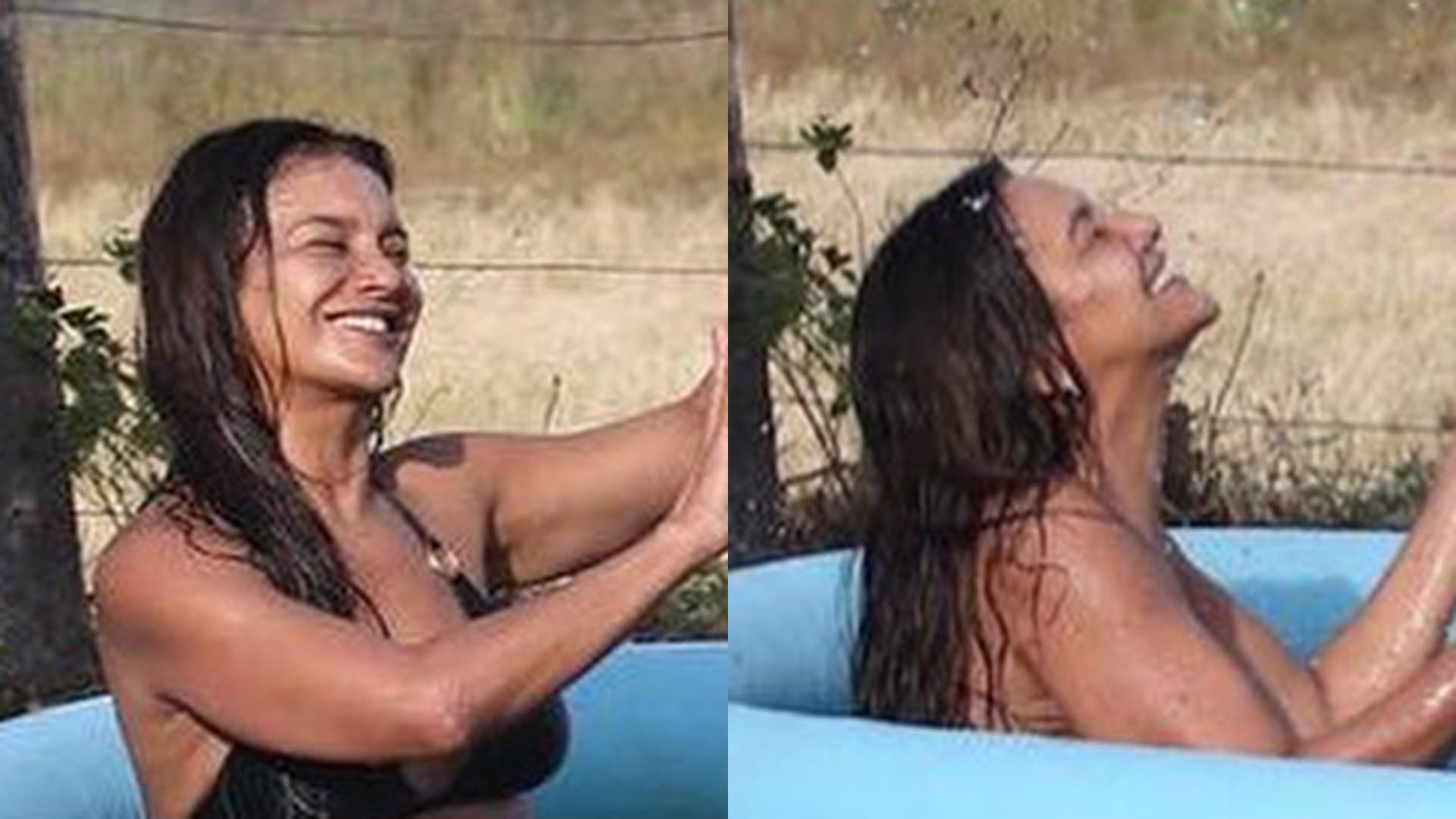 Dira Paes toma banho em piscina de plástico no intervalo de gravação