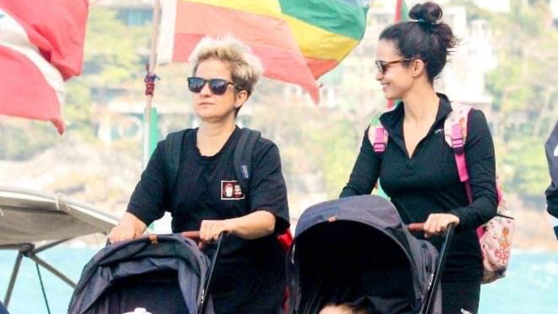 Nanda Costa e Lan Lanh correm em praia do Rio de Janeiro com as filhas