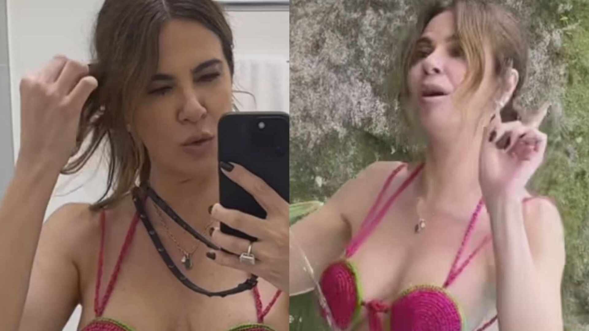 De roupa de banho de crochê, Luciana Gimenez toma banho de mangueira