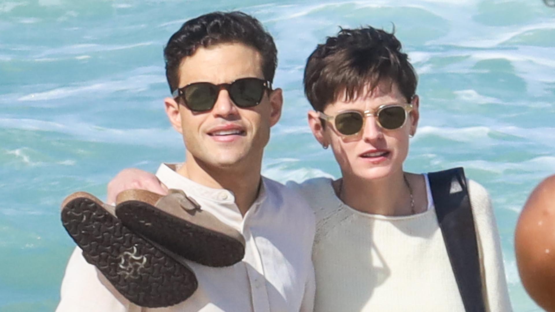 Rami Malek e Emma Corrin curtem dia na praia do Rio de Janeiro