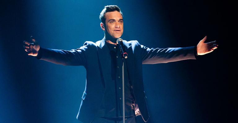 Robbie Williams dorme com seus cães