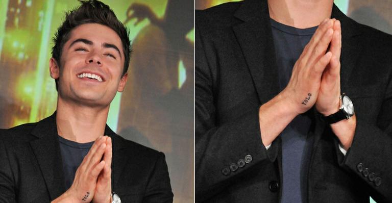 Zac Efron exibe tatuagem na mão durante evento no Japão