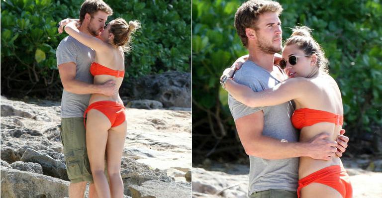 De biquíni, Miley Cyrus beija muito no Havaí