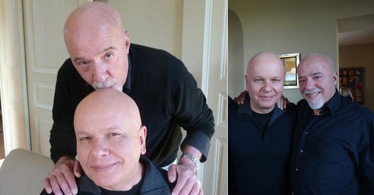 Em encontro na Alemanha, Paulo Coelho dá um beijo na careca de Marcelo Tas