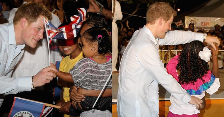 Príncipe Harry é recebido por festa em Belize