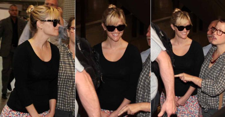 Sorrindo, Reese Whiterspoon desembarca no Brasil