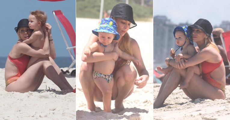 Momento mãe: Dani Winits brinca com Guy na praia