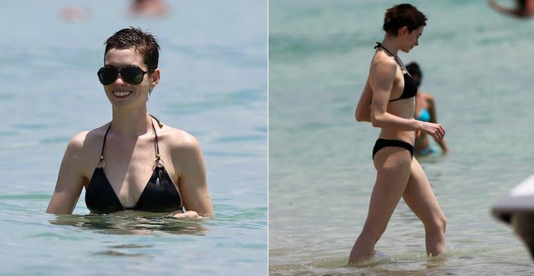 Anne Hathaway exibe boa forma em praia de Miami