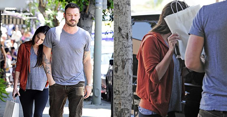 Com barriguinha aparente, Megan Fox tenta se esconder de paparazzi