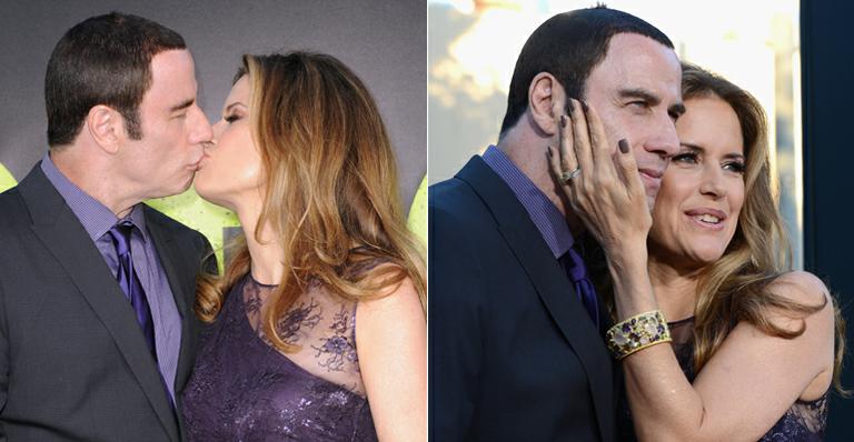 Em meio a escândalo, John Travolta beija a esposa Kelly Preston em tapete vermelho
