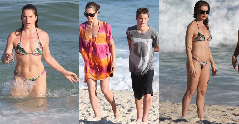 Letícia Spiller mostra boa forma em banho de mar no Rio