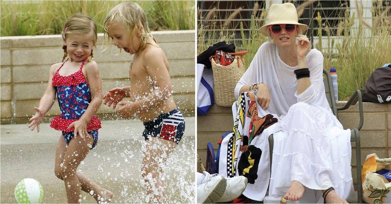De óculos pink, Gwen Stefani vai à praia com  os filhos