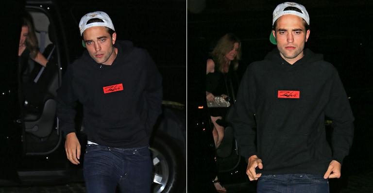Robert Pattinson vai a balada acompanhado de loira misteriosa