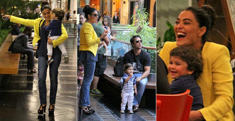 Juliana Paes passeia com o marido e o filho