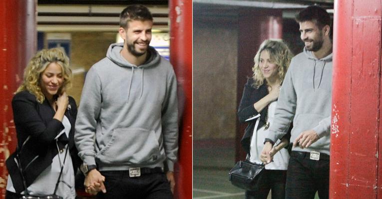 À espera do primeiro filho, Shakira e Piqué saem sorridentes de cinema