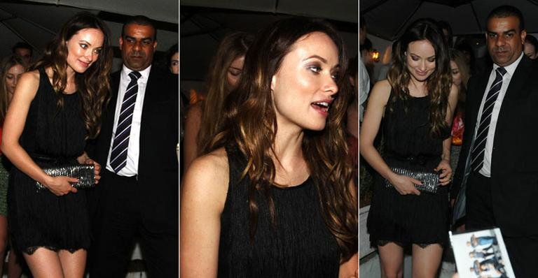 Cercada por seguranças, Olivia Wilde sai para jantar em São Paulo