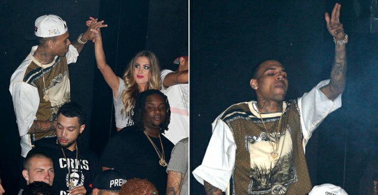 Solteiro, Chris Brown se diverte com loira em boate