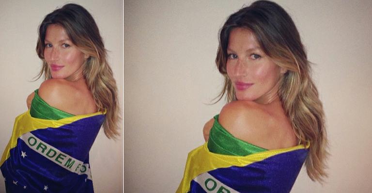 Gisele Bündchen fotografa em São Paulo enrolada na bandeira do Brasil