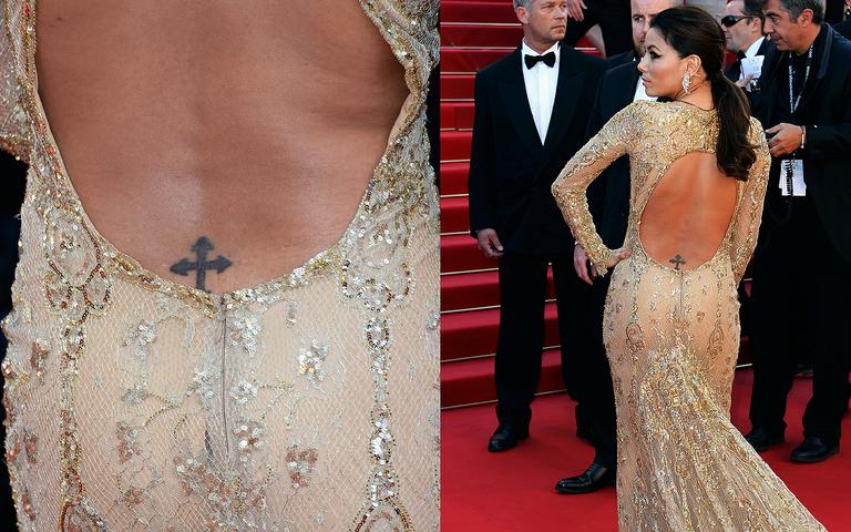 Vestido decotado revela tatuagem de Eva Longoria em Cannes