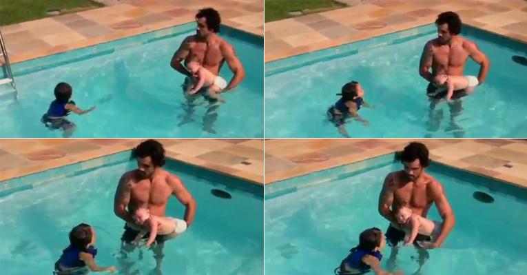 Juliano Cazarré brinca com os filhos na piscina