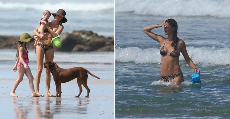 Gisele Bündchen vai à praia com a filha e mostra sua boa forma