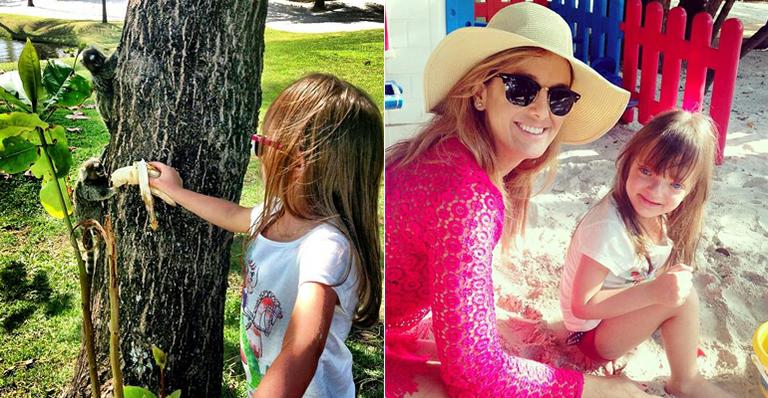 Rafaella Justus alimenta saguis com banana em parque