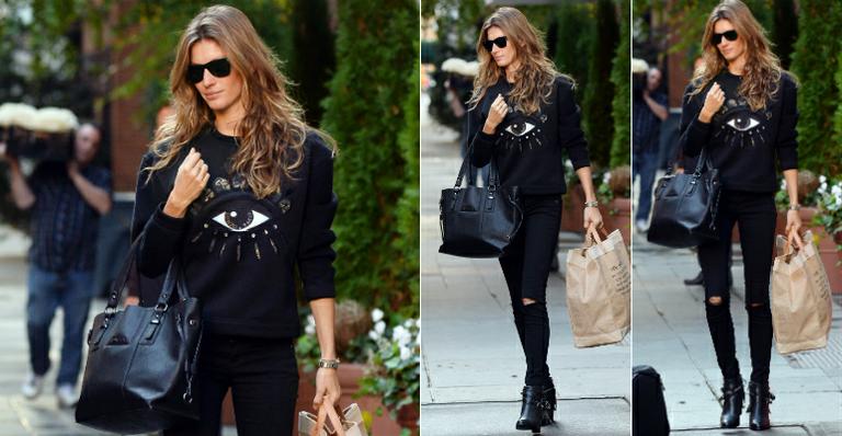 Gisele Bündchen adere ao look total black com moletom estampado