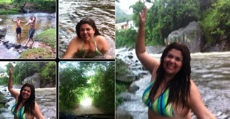 De biquíni, Fabiana Karla curte banho de cachoeira em dia de chuva