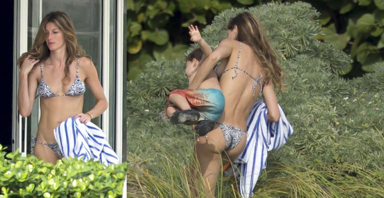 Gisele Bündchen brinca com o filho, Benjamin, na praia