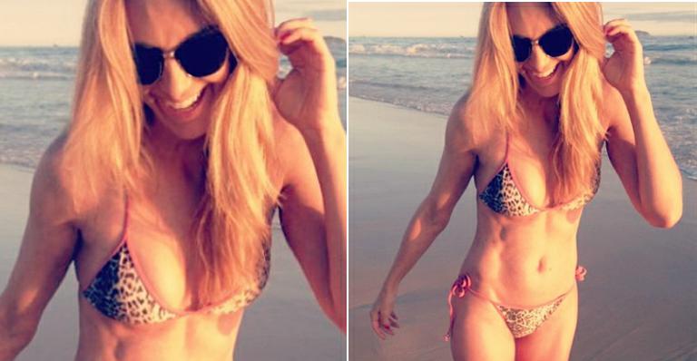 Ticiane Pinheiro exibe o corpão na praia em foto feita pela filha