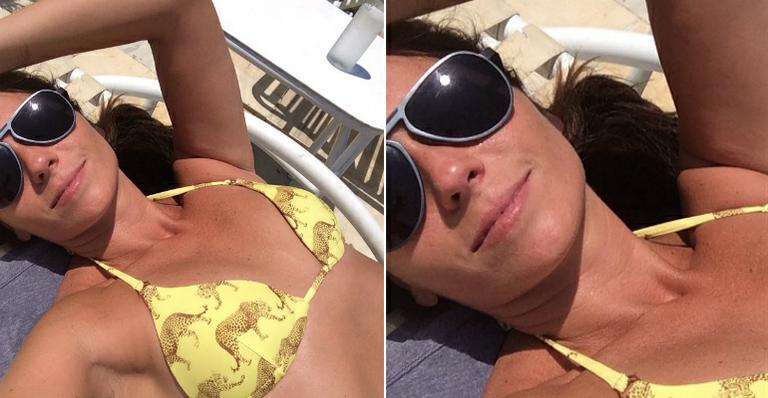De biquíni amarelo, Giovanna Antonelli curte o sol antes de gravação de novela