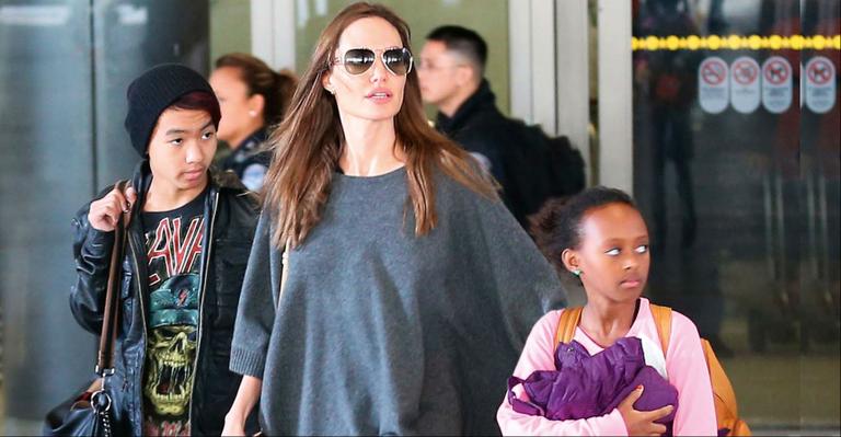 Angelina Jolie é vista em aeroporto de L.A. com os herdeiros Maddox e Zahara