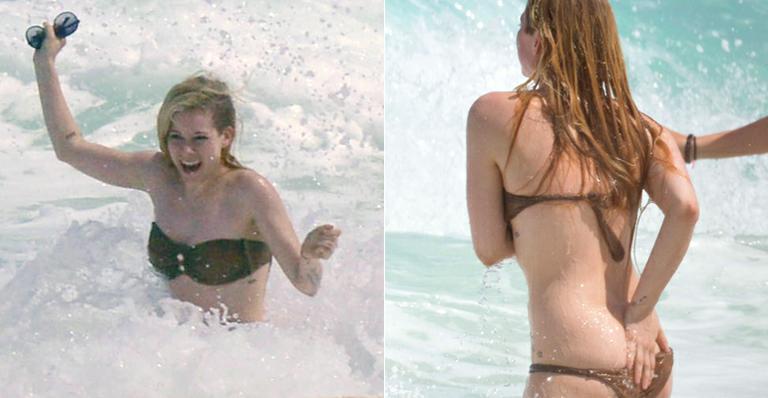 Avril Lavigne quase mostra demais durante banho de mar no México