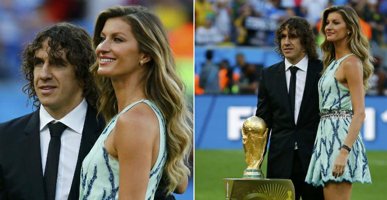 Gisele Bündchen e Puyol carregam a taça no Maracanã