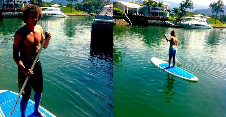 De férias, David Luiz pratica stand up paddle com a namorada