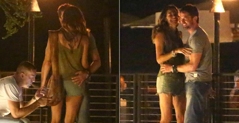 Gerard Butler troca beijos com morena na porta de restaurante