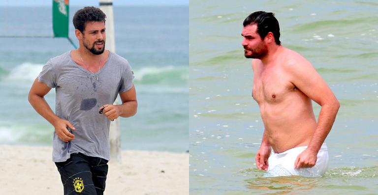 Cauã Reymond e Thiago Lacerda se exercitam em praia carioca