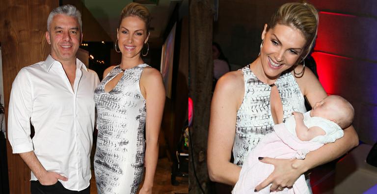 Ana Hickmann se encanta com bebê em evento