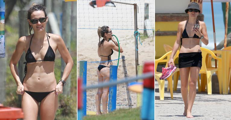 Bianca Bin exibe barriga chapada e toma banho de mangueira no Rio