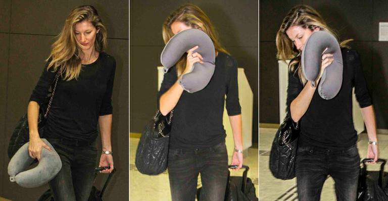 Gisele Bündchen esconde o rosto ao desembarcar em São Paulo