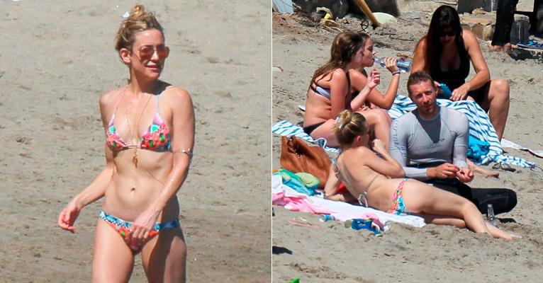 Aos 35 anos, Kate Hudson exibe barriga chapada em dia de praia com Chris Martin